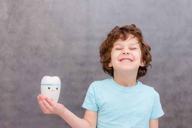 Come prevenire le carie nei bambini? 2 prevenire carie nei bambini sorriso